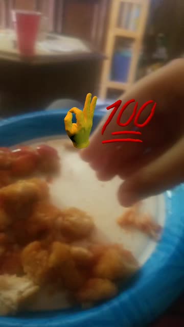 Preview for a Spotlight video that uses the OK Hand 100 Emoji Lens