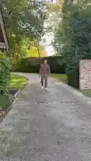In this exclusive look, Erling Haaland shares a snippet of his day. He's seen jogging down a private driveway in a stylish brown tracksuit before pausing to showcase a blue cylindrical product, possibly a supplement or skincare item. The serene, tree-lined setting suggests a focus on wellness and personal care. by @erling.haaland with Original Sound by erling.haaland