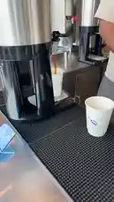 Watch as a barista demonstrates the proper technique for using a commercial coffee dispenser. This quick, informative clip shows the entire process, from filling a cup to adjusting the flow, providing valuable insights for anyone interested in coffee preparation. by @guruofmarketing with original sound