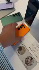 Get an exclusive look at the new Tecno Camon 50 Ultra smartphone in a vibrant orange color. This hands-on review showcases the device's unique camera array and sleek design, providing a comprehensive overview of its features. by @point_tech1 with Original Sound by point_tech1