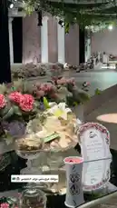Watch this beautifully styled wedding reception setup featuring lush pink and white floral arrangements, elegant glassware, and personalized guest favors. The scene captures a romantic ambiance with soft lighting, decorative columns, and a grand stage in the background. This is a perfect example of professional event styling and decor inspiration. by @nowaira-11 with original sound