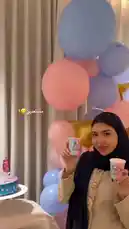 In a beautifully decorated room filled with pink and blue balloons, Sujha Design hosts a delightful baby gender reveal event. She holds up two cups—one labeled 'BOY' and the other 'GIRL'—to build suspense before revealing her baby's gender. A colorful cake sits nearby, adding to the festive atmosphere. This intimate celebration captures the excitement and joy of expecting a new arrival. by @soja_design with Original Sound by soja_design