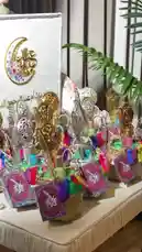 This video showcases a stunning collection of Eid gift baskets curated by Joy Narcissus. Each basket features intricately designed golden combs, ornate mirrors, colorful tassels, and decorative cards with Arabic calligraphy. The elegant presentation, set against a backdrop with a crescent moon and 'Eid Mubarak' greeting, highlights thoughtful and luxurious gift ideas perfect for celebrating Ramadan and Eid. by @joy.narcissus with Original Sound by joy.narcissus