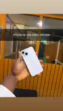 In this exclusive look, Frekas Global showcases the sleek new white iPhone 14. The phone is held in hand, highlighting its minimalist design and dual-camera setup against a modern interior backdrop. This quick reveal promises a glimpse into the latest tech from Apple. by @frekasglobal with Mofe by Mavo