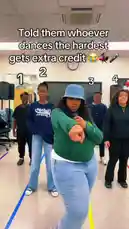 In a lively classroom setting, a group of students enthusiastically participate in a dance challenge where the person who dances the hardest wins extra credit. The lead dancer, holding a microphone, guides the energetic routine with infectious enthusiasm, while her peers follow along with smiles and impressive moves. The atmosphere is full of fun, motivation, and school spirit. by @uniquepearlz with uniquepearlz by Original Sound