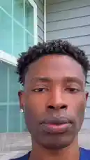 In this close-up, candid moment, content creator Delly shares his reaction to a trending event. Filmed outdoors in natural light, he speaks directly to the camera with an expressive face, offering viewers an authentic glimpse into his thoughts. This personal vlog-style clip captures real-time emotion and engagement, inviting audience interaction. by @delwinbazilme with original sound
