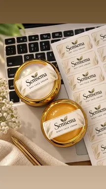 A top-down view showcases Semsema's herbal day and night face creams, presented in elegant gold pots alongside branded labels on a laptop keyboard. This aesthetic setup highlights the product packaging and branding, suggesting a professional review or promotional content for the skincare line. by @semsemallc25 with احلي منهم by ايهاب توفيق