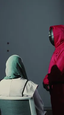 This promotional video introduces DirectLine digital business services. It begins with a dramatic scene inspired by 'Squid Game,' showing a person in a hijab being addressed by figures in red hooded suits. This powerful imagery transitions into a clear presentation of the company's branding, contact information, and office location, effectively capturing attention before delivering key details. by @directline with directline by Original Sound