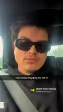 A close-up shot shows Wyatt Soderstrom sitting in a car, wearing a black hoodie and dark sunglasses. He looks directly at the camera with a neutral expression. In the lower right corner, a music player overlay displays the song 'HOPE YOU KNOW' by WYW and Birdrit. The background is the interior of the vehicle, suggesting a casual, personal moment. by @wyattsoderstrom with HOPE YOU KNOW by WYWY and Birdriot