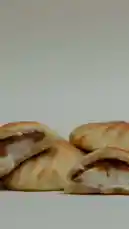 This close-up video showcases freshly baked pastries from مولادون | MOLADONE, revealing their golden-brown crusts and soft, layered interiors. The simple presentation highlights the appealing texture and quality of these homemade treats. by @moladone with original sound