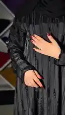 This stylish fashion video features Mohammad in a modern black abaya with elegant embellishments, set against a vibrant backdrop of colorful textiles. The video captures him posing confidently, highlighting the garment's details and his accessories, including a branded shopping bag from 'Khial Abaya'. With upbeat Arabic music playing, the scene creates a contemporary and chic atmosphere. by @mohammed_aldrop with ﮼انت ﮼الذي ﮼مايشبهك ♥️. by ﮼