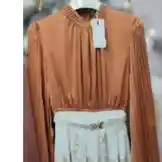 Watch this quick styling guide from كود اناقتي to learn how to create three different looks using one elegant outfit. This versatile ensemble features a high-neck pleated blouse paired with a floral skirt, demonstrating how simple changes can transform your style. by @code.a3 with original sound