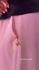 A close-up look at styling a gold 'M' monogram charm on a light pink skirt. This fashion-focused clip from Blushing Boutique demonstrates a simple way to add a personalized touch to your outfit. by @bx301a with original sound