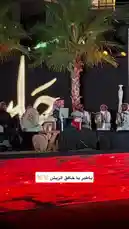 A captivating live performance by a traditional Arabic musical ensemble during an evening 'Jalsah' event. Musicians dressed in cultural attire play authentic instruments like the oud and frame drums under warm stage lights, with a vibrant red LED floor display enhancing the festive atmosphere. by @jalsahevent with jalsahevent by Original Sound
