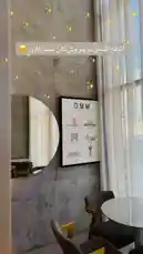 Step into the serene ambiance of Sequence Coffee. This stylish corner features a textured concrete wall, a modern round mirror, and a framed poster of DMM landmarks. Soft natural light filters through sheer curtains, creating a peaceful spot perfect for relaxing with your coffee. by @sequence-coffee with Life sound🪷🌱 by 🌺✨🐚💗