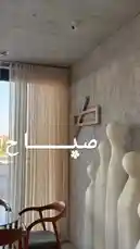 A serene look inside Sequence Coffee, showcasing minimalist design with concrete walls, wooden furniture, and elegant white sculptures. The bright, airy space features large windows with sheer curtains, creating a peaceful ambiance perfect for work or relaxation. by @sequence-coffee with موسيقى رايقه 🎵 by موسيقى