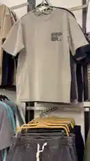 A close-up look at a casual men's outfit featuring a light gray graphic t-shirt and dark gray cargo pants with a white drawstring waistband. This simple yet stylish combination is perfect for everyday wear. by @code.a3 with original sound