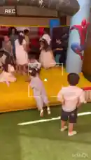 A lively children's birthday party unfolds inside a large yellow inflatable bounce house. Kids in colorful clothes run, jump, and play together under a Spider-Man themed archway, creating a joyful atmosphere perfect for celebrations. by @pie77com with Original Sound by pie77com