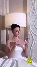 In this behind-the-scenes look, beauty artist نــويـره ارتسـت 💄 shares her professional techniques for enhancing features. She demonstrates applying lip color with precision while wearing a stunning white strapless gown and elegant jewelry, creating a radiant bridal glow perfect for special occasions. by @nowaira-11 with original sound