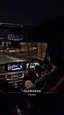 A man drives a luxury SUV through city streets at night. The interior is illuminated with vibrant purple ambient lighting, highlighting the modern dashboard and red leather seats. He navigates the vehicle smoothly while upbeat Punjabi music plays from the car's sound system. by @moazzam with Original Sound by moazzam