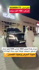 Watch a detailed walkthrough of a pristine black Nissan Patrol 2024 SUV. A man in traditional white attire showcases the vehicle's exterior and interior features, including its luxurious velvet seats and low mileage of just 5,400 km. The car is presented at a dealership, highlighting its showroom condition and warranty details. by @aaaaaa with Original Sound by aaaaaa