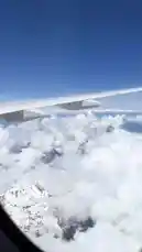 Experience a breathtaking journey above the clouds with Dream Path. This stunning aerial footage captures the majestic beauty of snow-covered mountain ranges under a clear blue sky, viewed from an airplane window. The serene visuals are accompanied by a reflective Arabic voiceover, inviting viewers to ponder life's deep questions. by @dream1path with Original Sound by dream1path