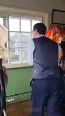 This video provides a first-person perspective from inside a traditional railway signal box. A man in a waistcoat operates the levers to control signals and points for passing trains. The camera pans across the intricate mechanical controls and then out the window to show the railway tracks, a stone signal box building, and a steam locomotive, offering a fascinating look at the inner workings of a heritage railway. by @maddi_op with maddi_op by Original Sound
