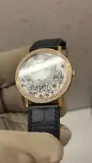 A close-up showcase of a luxurious Piaget Altiplano Ultimate watch, highlighting its rose gold case, diamond bezel, and intricate skeleton dial. A voiceover provides details about the model year, size, and market price. by @lussowatches with Original Sound by lussowatches