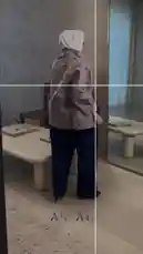 This video showcases a woman modeling a fashionable outfit from Artal Fashion أرتال. She is seen wearing a light purple floral jacket paired with dark wide-leg pants and a white hijab. The video includes close-ups of the jacket's intricate details and text overlays in Arabic, such as 'صامدون' (Sāmidūn), 'ولا' (Walā), and 'تنكسر' (Tanakasir), which may be part of a brand campaign or thematic message. by @artal.street with original sound