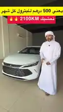 Watch a detailed walkthrough of the new white BYD Qin EV electric car in a showroom. A man in traditional Emirati attire demonstrates its advanced features, including the digital dashboard, infotainment screen, steering wheel controls, and the 'Auto Park' function. The video highlights the car's modern interior, smart entry systems, and overall design. by @aaaaaa with Original Sound by aaaaaa