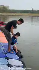 This video shows a young boy learning to use a flyboard on a lake. An adult helps him get onto the device, which then lifts him into the air using water jets. He successfully hovers above the water before returning to the dock. The video demonstrates the fun and excitement of flyboarding for beginners. by @maddi_op with maddi_op by Original Sound