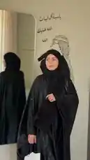 This captivating visual narrative follows Mohammad Al Khayal as he explores themes of personal style and cultural identity. The video features him in a sleek black abaya, transitioning through various settings including a modern interior with Arabic calligraphy art and a stylish retail space. He is seen posing thoughtfully, holding a branded shopping bag, and interacting with his surroundings, all set against a backdrop of upbeat Arabic music. The sequence captures a blend of contemporary fashion and traditional elements, creating a dynamic portrait of modern expression. by @mohammed_aldrop with Original Sound by mohammed_aldrop
