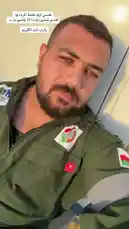 A close-up selfie of a man in a green military uniform, identified as Egyptian, speaking directly to the camera. Arabic text overlays his image, translating to: 'If I am killed, I will be martyred. If I am captured, I will be a prisoner. This is my promise.' His expression is resolute. In the background, a male voice chants a powerful, solemn religious phrase in Arabic, creating a tense and dramatic atmosphere. by @vii35_1 with Original Sound by vii35_1