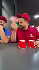 In a fun moment at Chick-fil-A, employees in red and blue uniforms play a classic shell game with branded cups. After some quick shuffling, one employee reveals a stack of cash under his cup, leading to a moment of surprise and laughter among the team. by @elqaq with Original Sound by elqaq