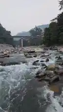 Experience the tranquil beauty of nature with this immersive journey along a fast-flowing river. The camera glides over rocky beds and beside lush green hills, capturing the essence of an easy-going adventure through scenic landscapes. by @vipularora05 with Original Sound by vipularora05