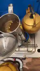 Watch as D. Turki Alafasi demonstrates the process of cooking sabudana khichdi on a gas stove. This traditional Indian dish involves boiling sabudana pearls in water until they become soft and translucent. The close-up shot captures the bubbling pot and golden kettle, providing a clear view of the cooking technique. by @alafasy81 with original sound