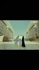 This heartwarming video captures the essence of family life in Qatar, showcasing moments of joy, tradition, and national pride. It begins with a father and mother holding hands with their young son in a modern city plaza, symbolizing unity. The scenes transition to everyday family activities, including a mother braiding her daughter's hair, a child enjoying a drink, and another playing with a toy car. A young girl is seen riding a bicycle with her parents, and later, a woman playfully lifts a child into the air. The video concludes with a powerful image of a family standing together, hand-in-hand, in front of a waving Qatari flag, with the text 'Hand in Hand' displayed, emphasizing themes of togetherness and patriotism. by @qatar with Original Sound by qatar