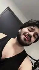 In a lighthearted and energetic clip, fitness enthusiast D SUN 🇦🇪🇮🇳 films himself in a home gym setting. Wearing a black tank top, he smiles and makes playful gestures at the camera while a traditional song plays in the background. The scene captures a fun, personal moment during his workout routine. by @dsunmusic with Original Sound by dsunmusic