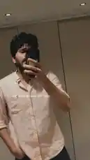 A man takes a mirror selfie on his Saturday, showcasing his casual style in a light pink button-down shirt. The text overlay reads 'Saturday looked like this >' as he poses and adjusts his phone. A soulful Hindi song plays in the background, setting a relaxed and reflective mood. by @dsunmusic with Original Sound by dsunmusic