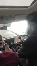 This immersive, first-person perspective captures a journey through thick fog while driving a modern car. The windshield wipers are actively clearing condensation and rain, highlighting the challenging visibility. The driver's hands are visible on the steering wheel, and the vehicle's dashboard features illuminated controls, providing a realistic look at navigating in poor weather. This raw, unedited footage offers a practical demonstration of driving safely in adverse conditions. by @amohammad_97 with amohammad_97 by Original Sound