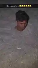 This viral social media clip captures a group of young men participating in a classic 'boys being boys' prank. One by one, they are buried in sand up to their necks, creating a surreal and humorous scene. The video is set to a dramatic, low-frequency audio track, enhancing the comedic effect. It's a perfect example of youthful mischief and internet humor. by @levis_ian with Original Sound by levis_ian