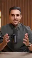 A man sits at a desk with a microphone, introducing a new project called 'Code Behind Success.' He explains that while everyone talks about success after it happens, his channel focuses on the unseen struggles before the spotlight. He describes this as the 'silent chapter' filled with fear, pressure, rejection, and mistakes. The video is a global interview project featuring real people from different countries who overcame these challenges because they refused to give up. by @codebehindsucce with Original Sound by codebehindsucce
