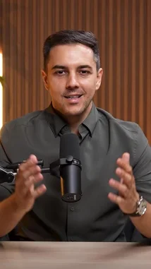 A man sits at a desk with a microphone, introducing a new project called 'Code Behind Success.' He explains that while everyone talks about success after it happens, his channel focuses on the unseen struggles before the spotlight. He describes this as the 'silent chapter' filled with fear, pressure, rejection, and mistakes. The video is a global interview project featuring real people from different countries who overcame these challenges because they refused to give up. by @codebehindsucce with Original Sound by codebehindsucce