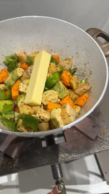 Watch as Dr. Turki Al-Afasi demonstrates the initial steps of preparing a delicious vegetable biryani. This close-up cooking tutorial shows diced vegetables like carrots and zucchini being seasoned and placed in a pan with butter over medium heat. The speaker narrates in Arabic, explaining the process of sautéing the ingredients before adding rice to create a royal-style biryani. A perfect guide for home cooks looking to master this aromatic dish. by @alafasy81 with Original Sound by alafasy81