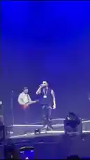 Witness the electrifying atmosphere of Moazzam Ishaq's live concert. This fan-shot footage captures his dynamic stage presence as he performs for a massive crowd under dramatic blue lighting. See him engage with fans, walk the stage, and experience a spectacular fire effect during the show. by @moazzam with Original Sound by moazzam