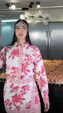 This video follows a woman, Fahad Arif, as she prepares a large batch of food in her kitchen and then takes it out to serve a crowd of people in a community setting. The scenes transition from close-ups of cooking ingredients like eggs and vegetables to wide shots of her interacting with a group of children and adults on a street. by @maddi_op with maddi_op by Original Sound