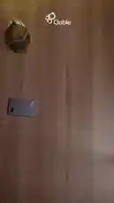 This video presents a clean, top-down view of a modern tech setup, featuring a variety of devices including Apple products and Qable accessories. It begins with a hand placing a device on a wooden surface next to a decorative lantern, then pans out to reveal a full collection of gadgets like a smartwatch, smartphones, and earbuds. Arabic text overlays introduce 'Qable' and its services. The video concludes with a branded outro screen displaying contact information. The minimalist aesthetic and focus on technology suggest it's a promotional piece for Qable's products or services. by @qable_qa with Original Sound by qable_qa