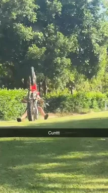 A man, identified as Levi Twine, is seen outdoors in a lush, green environment. He bends over near a white bowl on the ground, seemingly reacting to something unexpected. The scene is set against a backdrop of dense foliage and palm trees, suggesting a warm climate. by @levi_twine with Original Sound by levi_twine