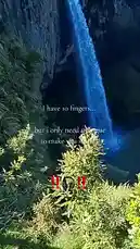 This short clip features a stunning waterfall with overlaid text reading 'I have 10 fingers... but I only need 1 tongue to make you smile.' The text is accompanied by a pair of headphones emoji and exclamation marks. The scene is set against a dramatic natural backdrop, creating a visually appealing moment that aligns with popular social media trends. by @mindseye_music with Original Sound by mindseye_music