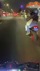 Experience a thrilling night ride through the city streets from a first-person perspective. This dynamic footage captures the energy of urban nightlife as a motorcycle follows another rider, weaving through traffic alongside buses and cars under the glow of streetlights and neon signs. by @be-sassyish with Tiimmy Turner by Desiigner